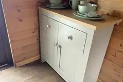 Camping pod side table with kitchen utensils Camping pod side table with kitchen utensils