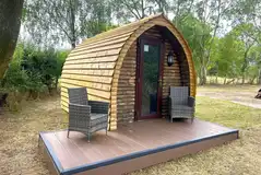 Wooden camping pod with a small deck area Wooden camping pod with a small deck area