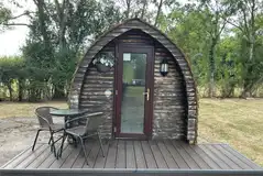 Pet friendly camping pod exterior with outdoor seating Pet friendly camping pod exterior with outdoor seating