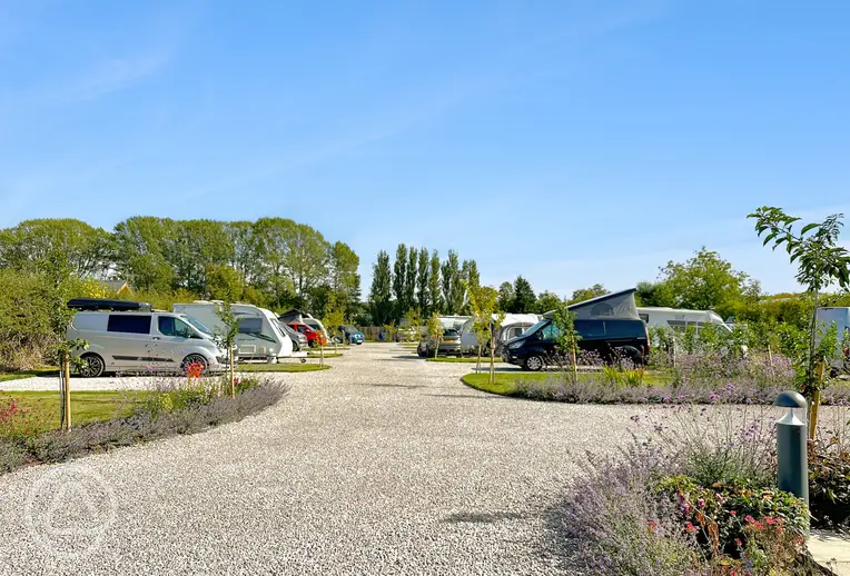 Electric gravel and grass pitches with 16 amp hook ups at Holly Tree Nook