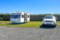 Grass and gravel touring pitches with optional electric Grass and gravel touring pitches with optional electric