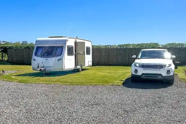 Grass and gravel touring pitches with optional electric