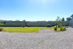 Grass and gravel pitches with picnic benches around site Grass and gravel pitches with picnic benches around site