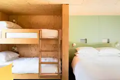 Camping cabins with a king bed and bunks (bedding provided)