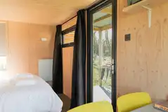 Camping cabins with a glass door to the deck