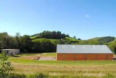 View of Meadowfields Campsite with a central facilities building