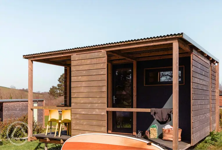 Camping cabins with a covered outdoor deck