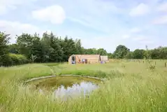 Waters Edge glamping pod with views over the pond