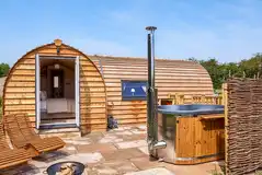 Campion pod with a wood-fired hot tub, fire pit and seating