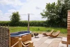 Waters Edge with a wood-fired hot tub, fire pit and seating