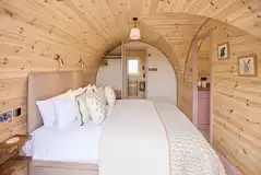 Campion king size bedroom with bedding and an ensuite bathroom