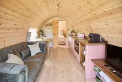 Campion pod living, dining and kitchen area with a smart TV