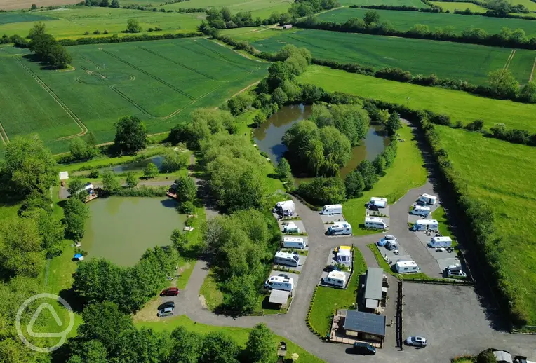 Woodlands Fishery with multiple lakes and fully serviced hardstanding pitches