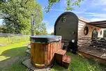 Lincoln waterside cabin with a wood-fired hot tub