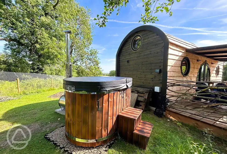 Lincoln waterside cabin with a wood-fired hot tub
