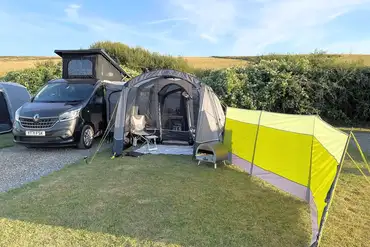 Electric hardstanding and grass pitches measuring 6m x 8m