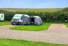 Electric hardstanding and grass pitches at Penally Court Farm 