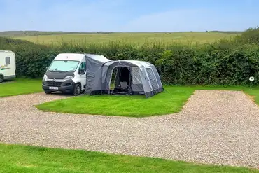 Electric hardstanding and grass pitches at Penally Court Farm 