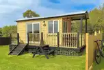 Shepherd's Hut exterior with private decking and picnic bench