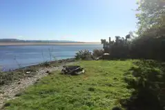 Grass and Wood Chip Riverside Pitches at Smugglers Cove Campsite