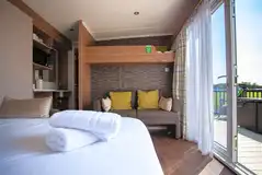 Cabin with a double sofa bed, single bunk and bedding