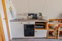 Kitchen with a sink, kettle, toaster, fridge, freezer, hob and combi oven Kitchen with a sink, kettle, toaster, fridge, freezer, hob and combi oven