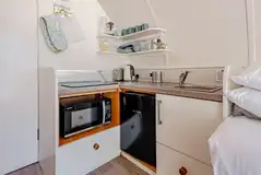 Kitchen with with a sink, kettle, toaster, fridge, freezer, hob and combi oven Kitchen with with a sink, kettle, toaster, fridge, freezer, hob and combi oven