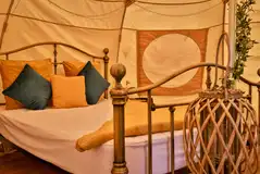 Bell tent interior with double bed (bring bedding)