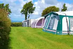 Electric Grass Pitches at Cornish Coasts Caravan and Camping Park