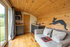 Meadow View glamping cabin kitchen and living area