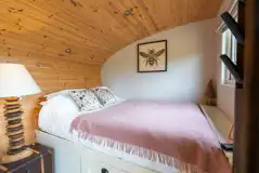 Meadow View glamping cabin bed 