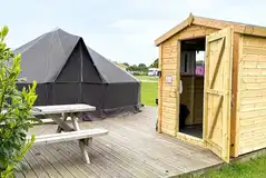 Bell tent with a kitchen hut