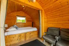 Camping pods with a double bed, kitchen unit and sofa bed