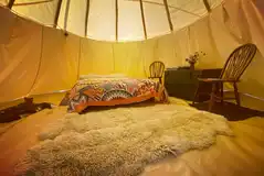 Tipi tent interior at night