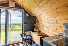 Willow glamping pod TV and seating area