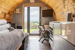 Alanna glamping pod interior and TV