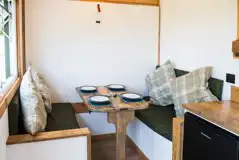 Rusty shepherd's hut dining area