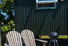 Rusty shepherd's hut outdoor seating area