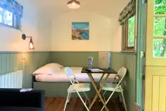 Shepherd's hut with a double bed and double sofa bed