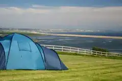 Eco Electric Grass Tent Pitches with Sea Views at Sea Barn Farm Camping Park