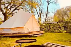 Bell tent exterior with fire pit