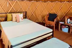 Double bed and camp bed inside the yurt