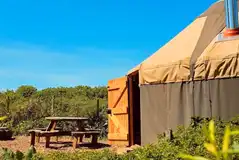 Yurt exterior and bench seating area