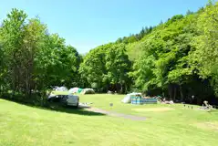Electric Riverbank Grass Pitches at Dolgamedd Holiday Park