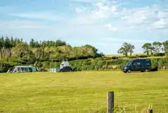 Electric Grass Pitches at Dewslake Farm Campsite