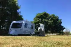 Electric Grass Caravan Pitch at Chase Camping at Four Oaks Farm