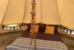 Bell tent with a double bed and bedding Bell tent with a double bed and bedding