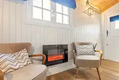 Hut seating area and electric fireplace Hut seating area and electric fireplace