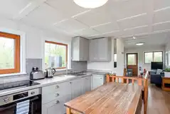 The Ark houseboat fully equipped kitchen and dining area