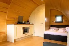 Glamping pod with a double bed, ensuite and kitchen